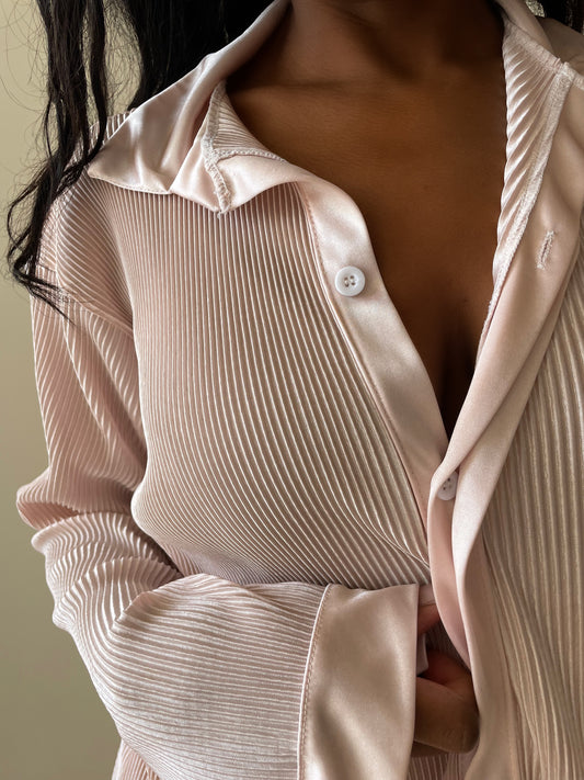 Model with long hair wearing Oversized Button Up Lounge Shirt in blush color
