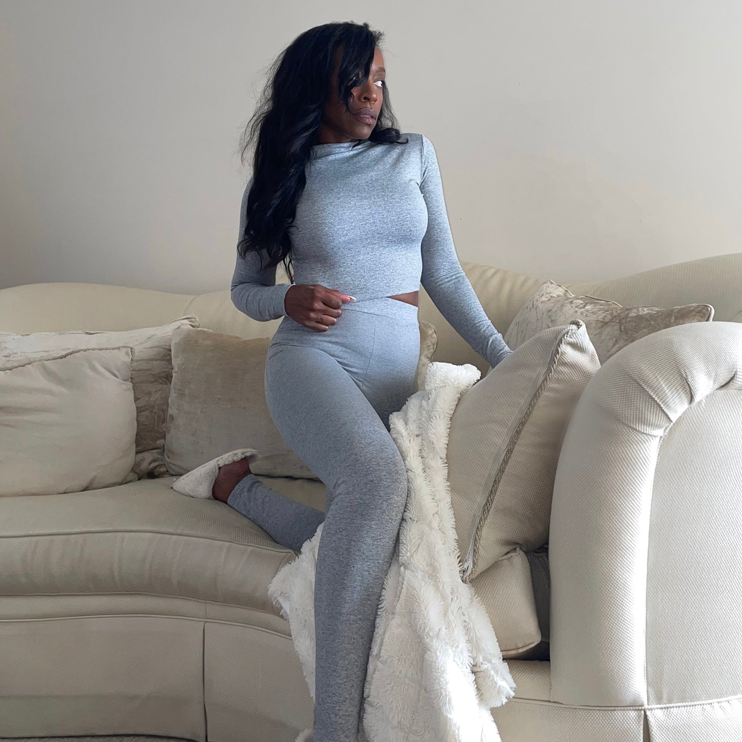 Model on cozy couch wearing High Waisted Leggings for Women Gray EveryDay Stretch Legging Side Front