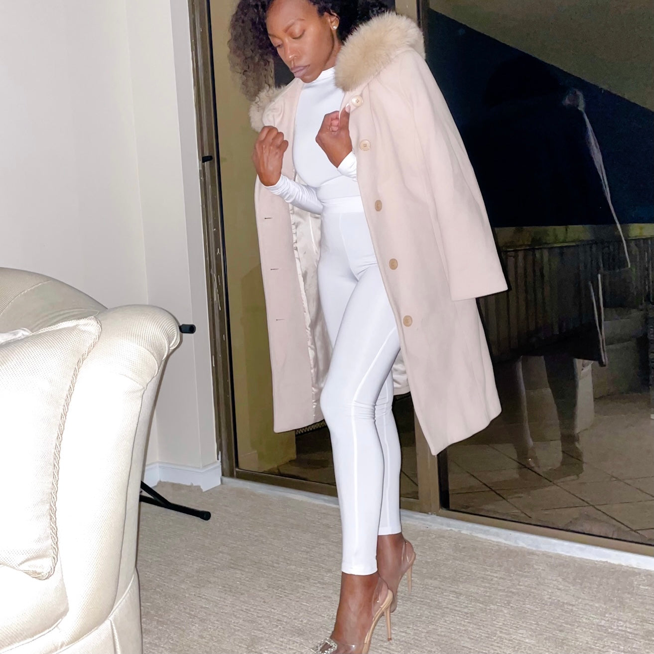 Model with long coat wearing 2 piece outfit with High Waisted Leggings for Women EveryDay Stretch Legging in white