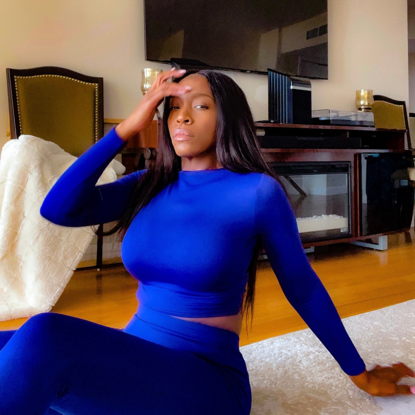 Model seated on floor wearing High Waisted Leggings for Women EveryDay Stretch Legging in Deep Blue