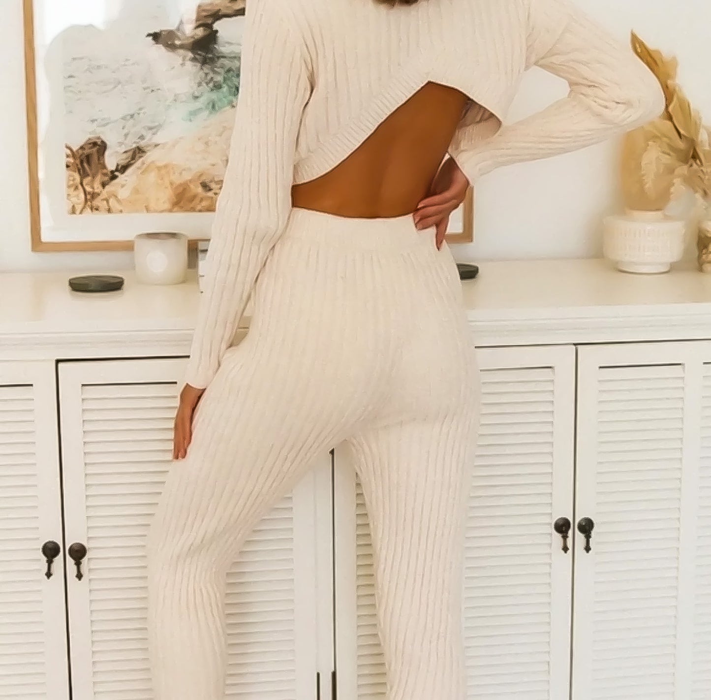 model wearing vanilla ribbed knit crop open back sweater