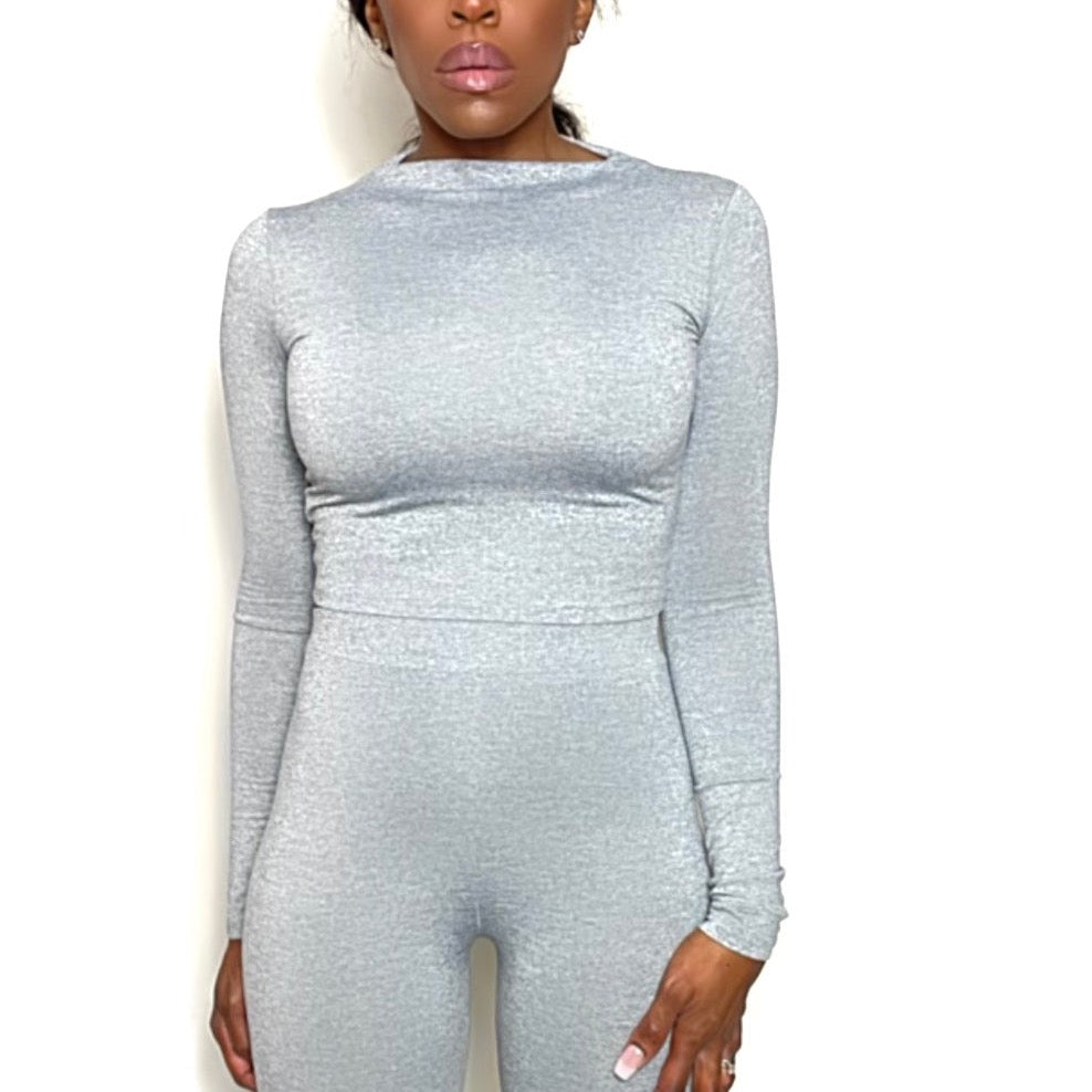 Model with white background wearing Mock Neck Stretchy Long Sleeve Crop Top