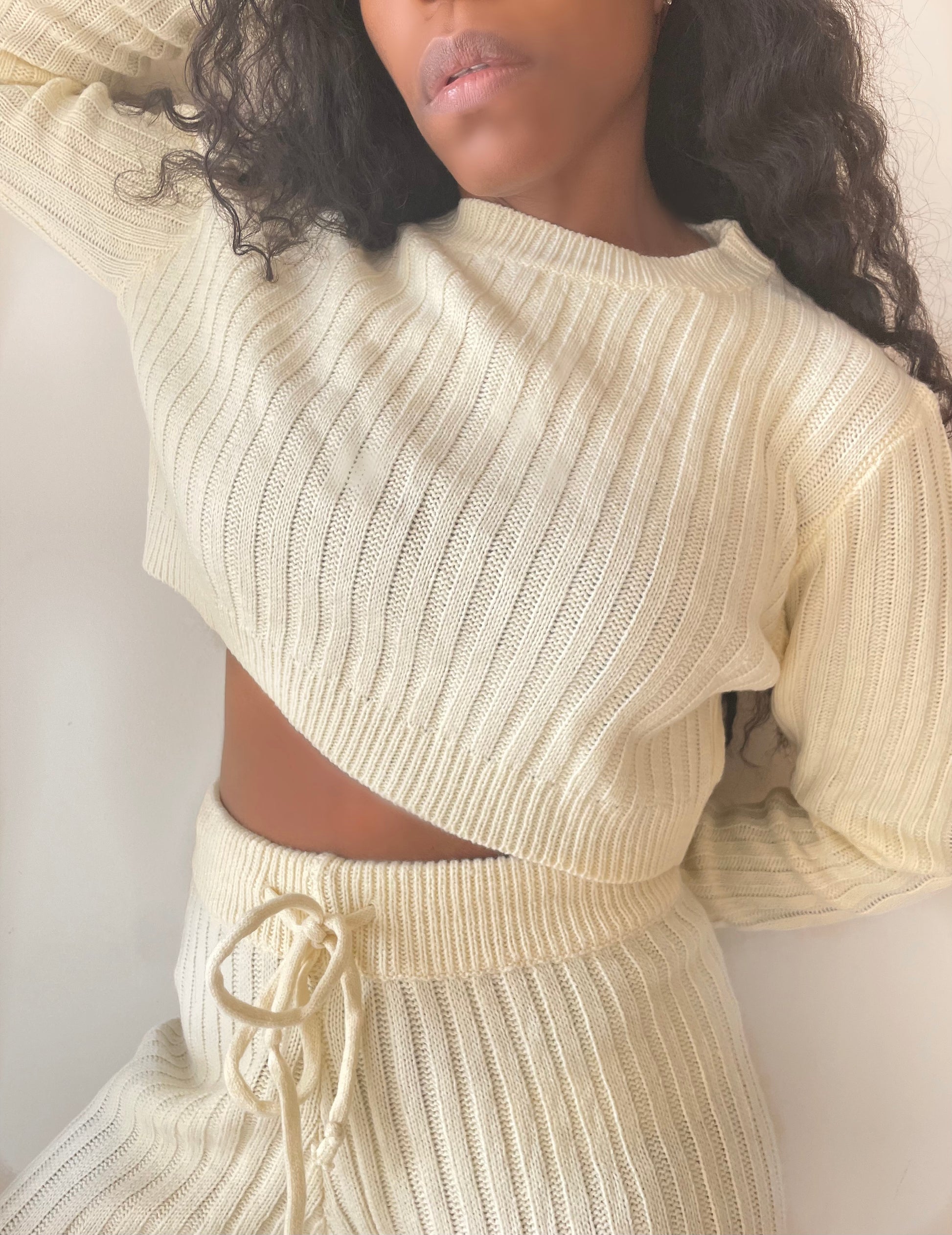 model wearing vanilla ribbed knit crop open back sweater