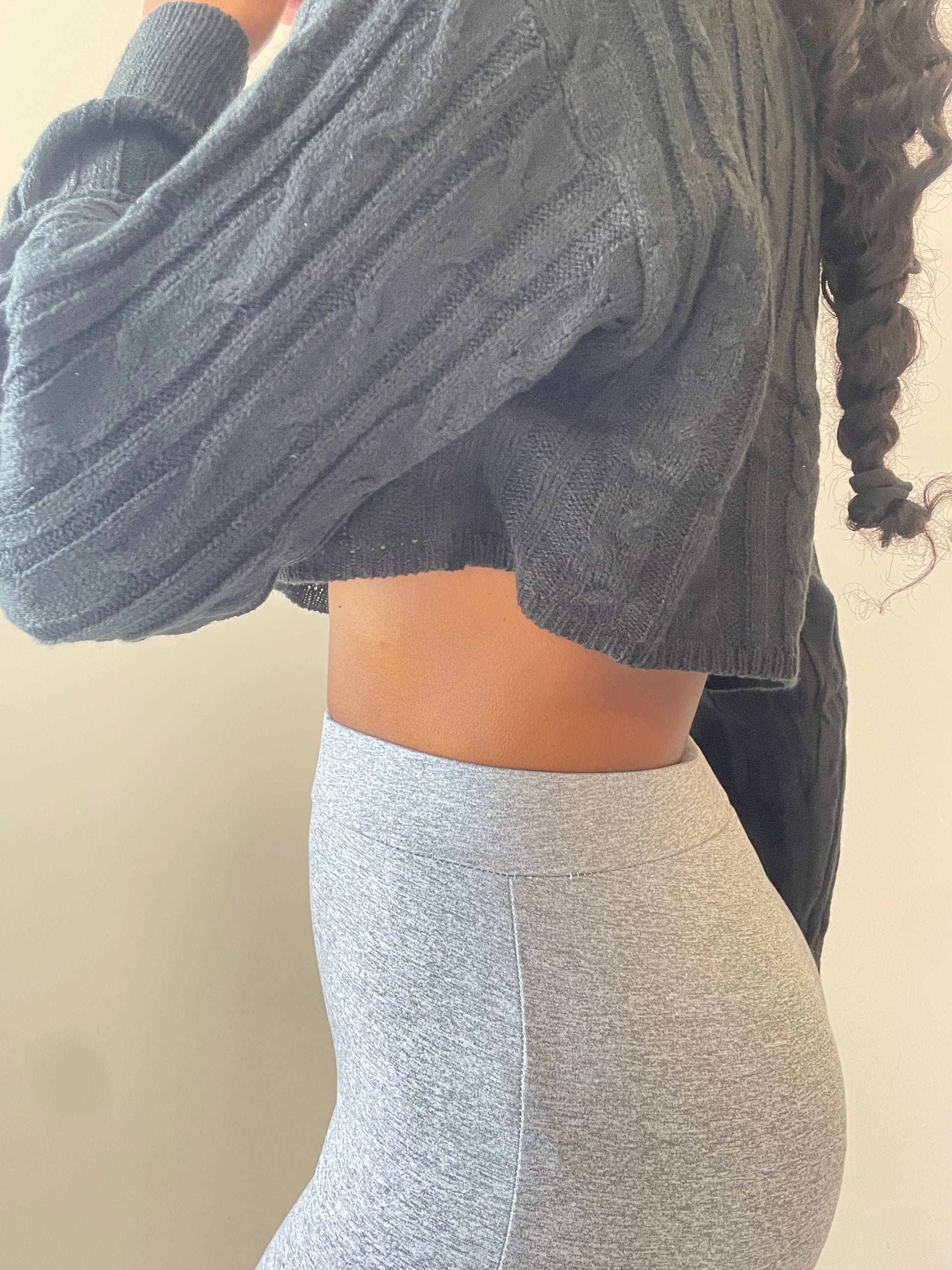 side waist view of Cropped Long Sleeve Sweater, black